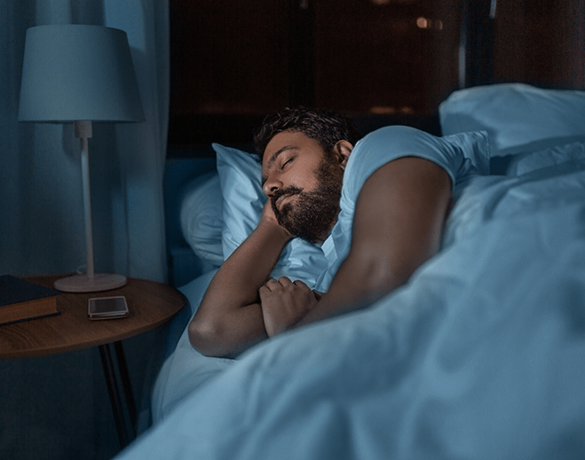 Person sleeping peacefully in bed at night