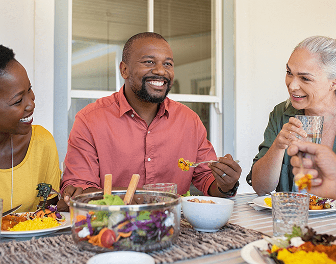 Adults sharing a healthy meal together